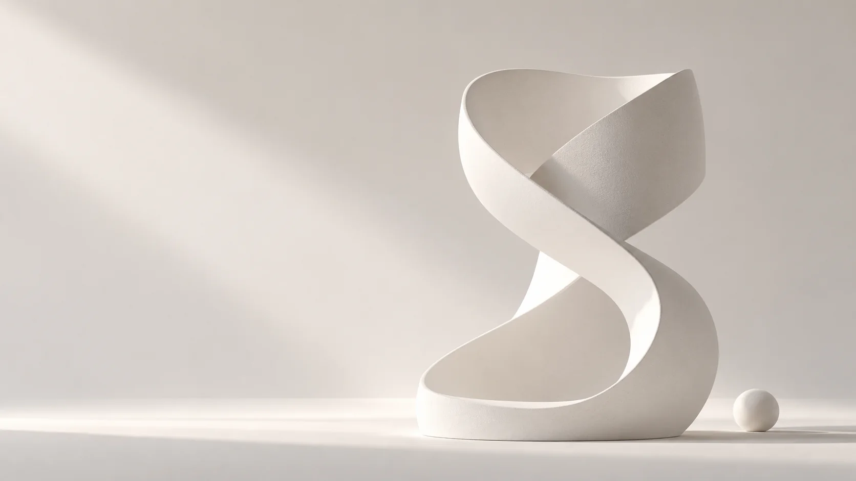 Sculptural ivory form — the Upgrade Web Development brand mark in dimensional light